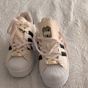 Adidas Superstar Sneakers in Cream, Black, and Gold